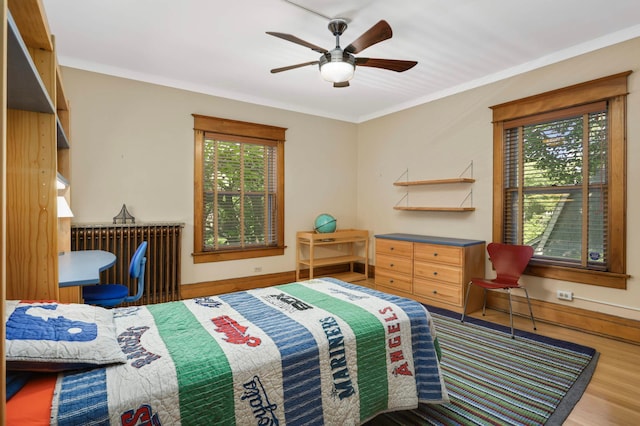 880 Fairmount Ave, Saint Paul, MN 55105 - bedroom featuring wood finished floors, crown molding, and ceiling fan