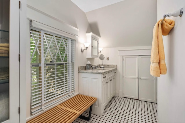 880 Fairmount Ave, Saint Paul, MN 55105 - bathroom with vanity, lofted ceiling, and tile patterned floors