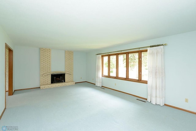 507 24th Ave S, Fargo, ND 58103 - unfurnished living room featuring carpet and a fireplace