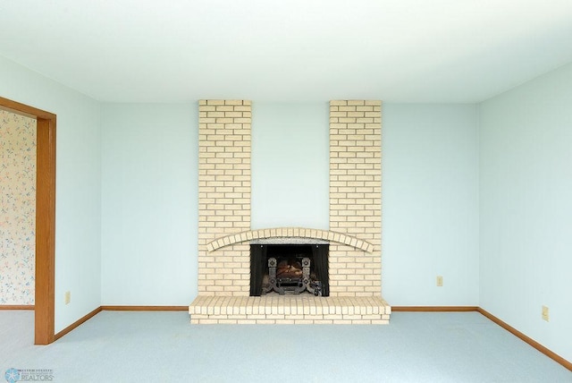 507 24th Ave S, Fargo, ND 58103 - unfurnished living room featuring carpet and a brick fireplace