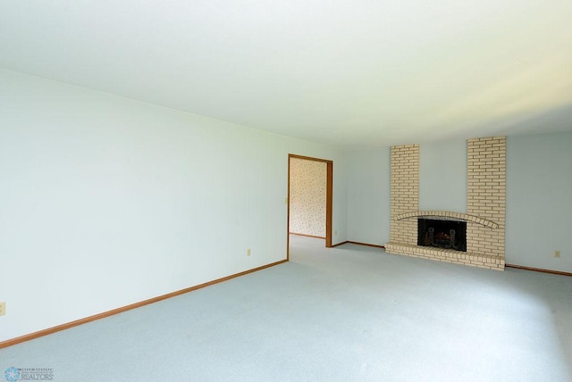 507 24th Ave S, Fargo, ND 58103 - unfurnished living room with light colored carpet and a brick fireplace