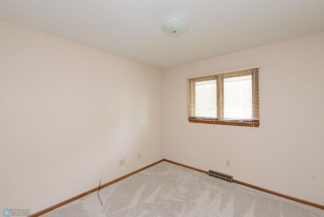 507 24th Ave S, Fargo, ND 58103 - unfurnished room featuring baseboards and light colored carpet