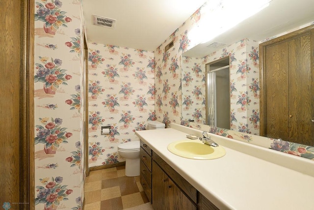 507 24th Ave S, Fargo, ND 58103 - bathroom with tile patterned floors, vanity, a stall shower, and wallpapered walls