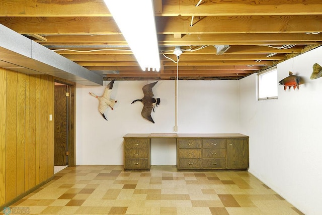 507 24th Ave S, Fargo, ND 58103 - basement featuring light floors, wood walls, and a desk