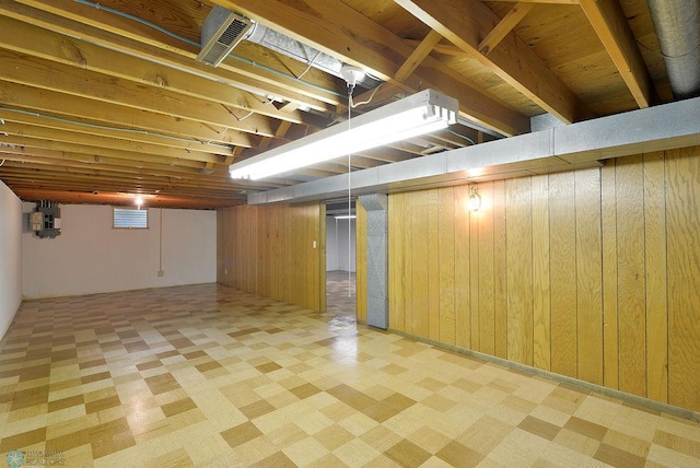 507 24th Ave S, Fargo, ND 58103 - basement with wooden walls and tile patterned floors