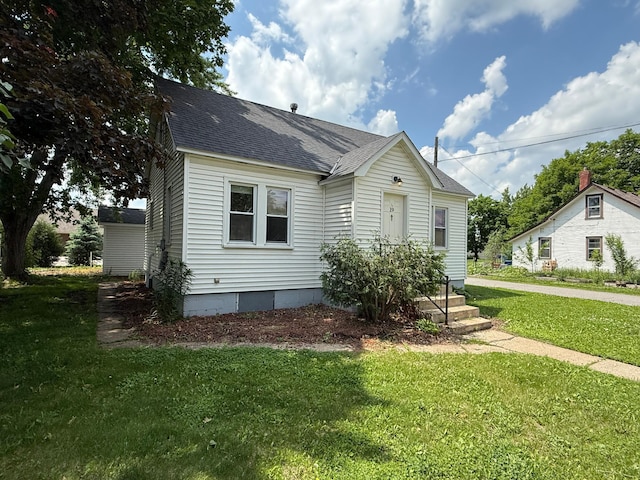 19 1st Ave NE, Saint Joseph, MN 56374 - view of front of property featuring roof with shingles and a front yard