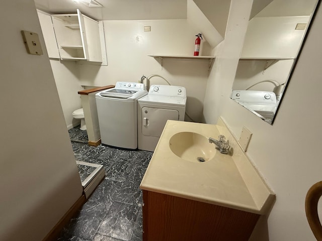 19 1st Ave NE, Saint Joseph, MN 56374 - laundry area with washer and dryer and baseboards