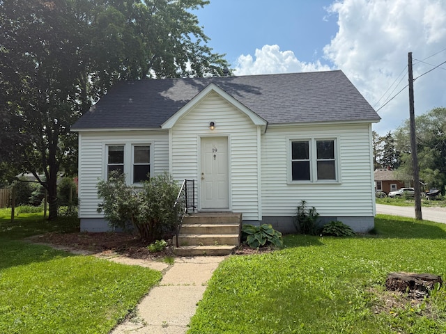 19 1st Ave NE, Saint Joseph, MN 56374 - view of front of property with a front yard and a shingled roof