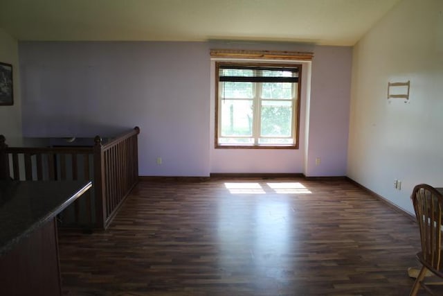 1027 Taft St S, Cambridge, MN 55008 - spare room featuring dark wood-type flooring and baseboards