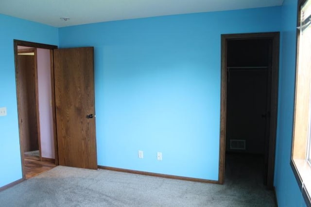 1027 Taft St S, Cambridge, MN 55008 - unfurnished bedroom featuring carpet floors and baseboards