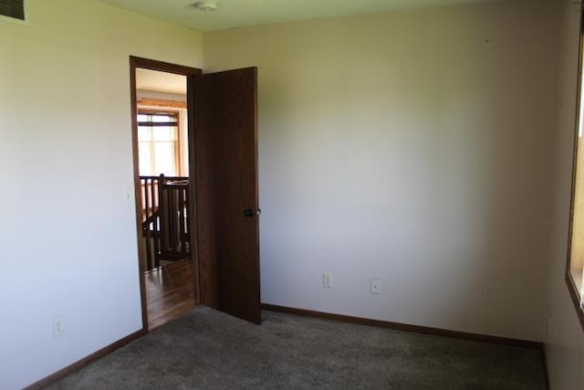 1027 Taft St S, Cambridge, MN 55008 - empty room with carpet flooring and baseboards