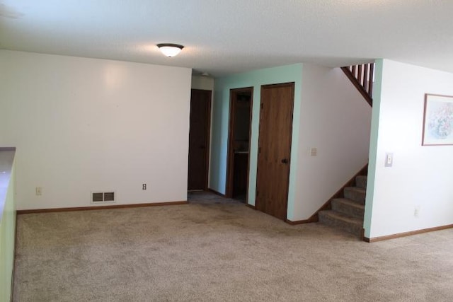 1027 Taft St S, Cambridge, MN 55008 - unfurnished room featuring stairs and carpet