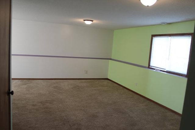 1027 Taft St S, Cambridge, MN 55008 - carpeted empty room with baseboards