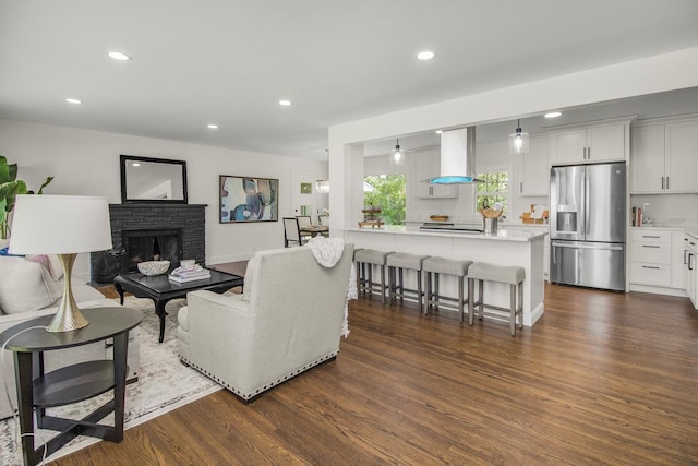 2307 Sherwood Cir, Bloomington, MN 55431 - living room with dark wood-style floors, a fireplace, and recessed lighting