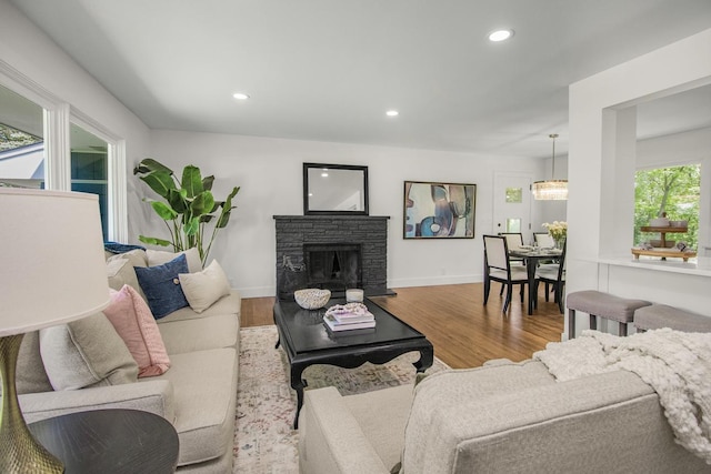 2307 Sherwood Cir, Bloomington, MN 55431 - living area with recessed lighting, wood finished floors, baseboards, and a stone fireplace