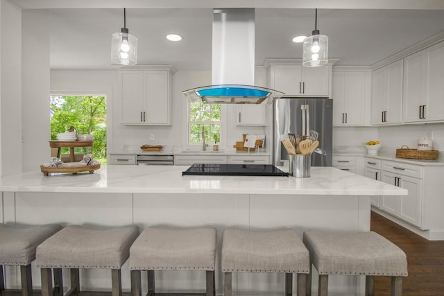 2307 Sherwood Cir, Bloomington, MN 55431 - kitchen featuring appliances with stainless steel finishes, island exhaust hood, recessed lighting, a sink, and white cabinetry