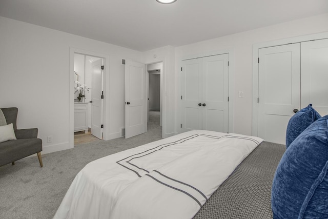 2307 Sherwood Cir, Bloomington, MN 55431 - bedroom with multiple closets, carpet flooring, baseboards, and ensuite bathroom