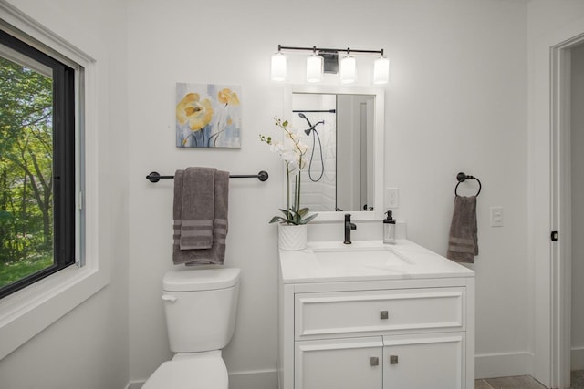 2307 Sherwood Cir, Bloomington, MN 55431 - bathroom with vanity, toilet, and baseboards