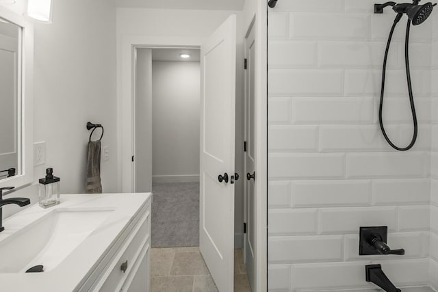 2307 Sherwood Cir, Bloomington, MN 55431 - bathroom with vanity, a shower, and baseboards