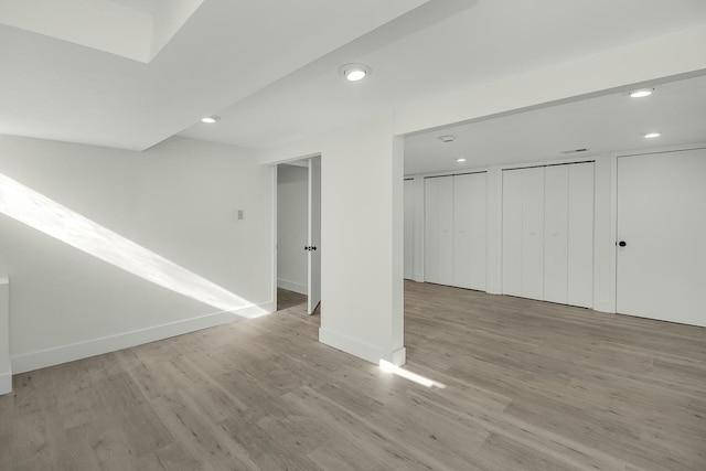 2307 Sherwood Cir, Bloomington, MN 55431 - finished basement featuring wood finished floors, recessed lighting, and baseboards