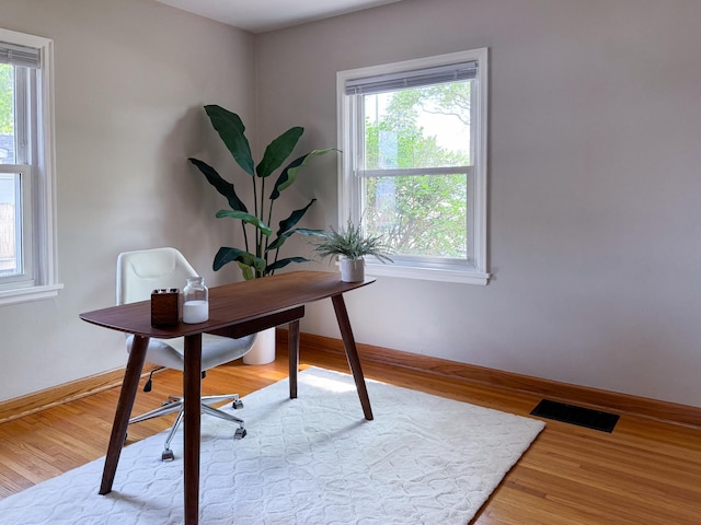 1759 Arlington Ave E, Saint Paul, MN 55106 - office with plenty of natural light, baseboards, and wood finished floors