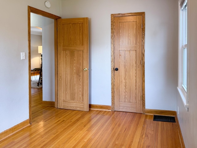 1759 Arlington Ave E, Saint Paul, MN 55106 - unfurnished bedroom with baseboards and wood finished floors