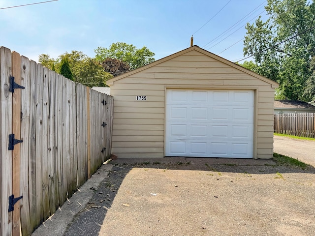 1759 Arlington Ave E, Saint Paul, MN 55106 - detached garage featuring concrete driveway