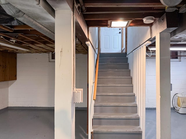 1759 Arlington Ave E, Saint Paul, MN 55106 - staircase featuring concrete floors and concrete block wall