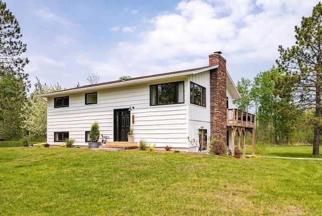 315 Pleasant View Rd, Duluth, MN 55803 - back of property featuring a chimney, a lawn, and a wooden deck
