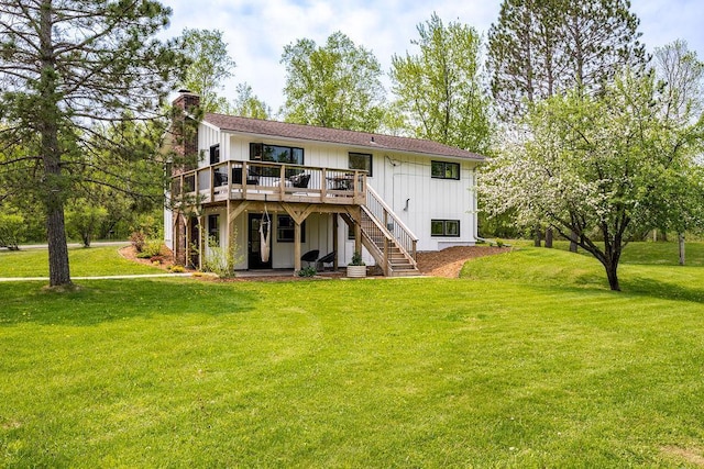 315 Pleasant View Rd, Duluth, MN 55803 - rear view of property featuring a deck, board and batten siding, a chimney, a yard, and stairs