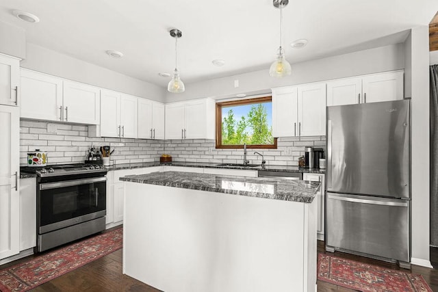 315 Pleasant View Rd, Duluth, MN 55803 - kitchen with stainless steel appliances, a sink, tasteful backsplash, and a kitchen island