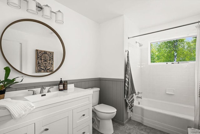 315 Pleasant View Rd, Duluth, MN 55803 - full bath with toilet, vanity, washtub / shower combination, wainscoting, and tile patterned flooring