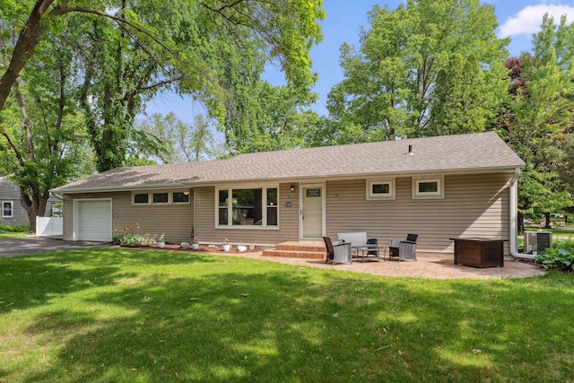 8400 Virginia Cir S, Saint Louis Park, MN 55426 - rear view of house with an attached garage, a lawn, cooling unit, asphalt driveway, and roof with shingles