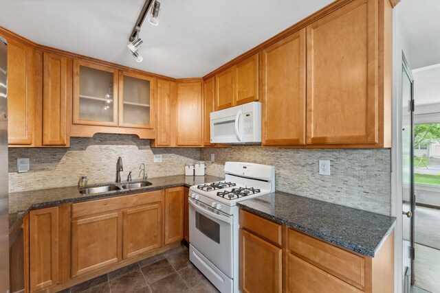 8400 Virginia Cir S, Saint Louis Park, MN 55426 - kitchen with white appliances, a sink, glass insert cabinets, backsplash, and dark stone counters