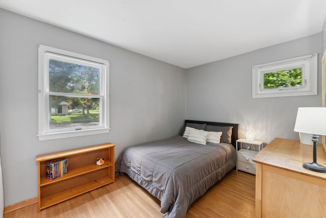 8400 Virginia Cir S, Saint Louis Park, MN 55426 - bedroom featuring multiple windows and light wood-style flooring