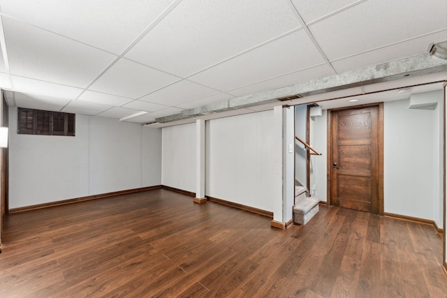 8400 Virginia Cir S, Saint Louis Park, MN 55426 - finished below grade area featuring a drop ceiling, baseboards, dark wood-style floors, and stairs