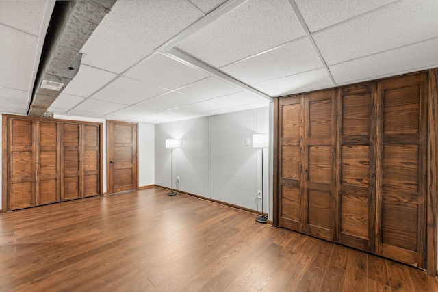 8400 Virginia Cir S, Saint Louis Park, MN 55426 - unfurnished bedroom featuring a drop ceiling, baseboards, and wood finished floors
