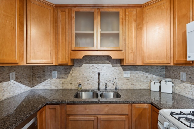 8400 Virginia Cir S, Saint Louis Park, MN 55426 - kitchen featuring a sink, backsplash, glass insert cabinets, dark stone counters, and brown cabinetry