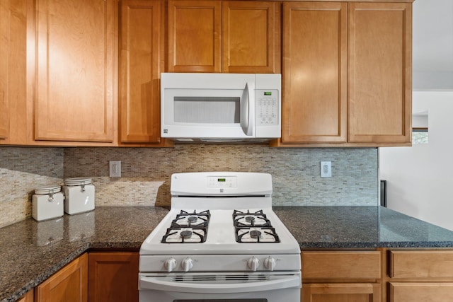 8400 Virginia Cir S, Saint Louis Park, MN 55426 - kitchen with white appliances, backsplash, and dark stone countertops