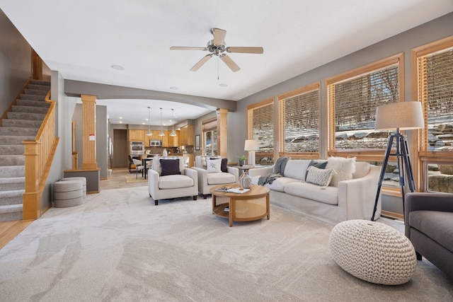 1496 Pinetree Trl, Eagan, MN 55122 - living room featuring decorative columns, a ceiling fan, recessed lighting, and stairs