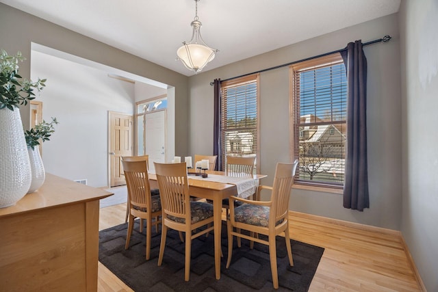 1496 Pinetree Trl, Eagan, MN 55122 - dining space featuring light wood-style flooring and baseboards