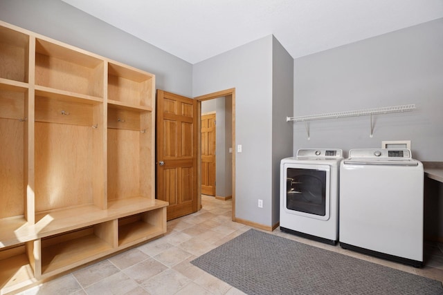 1496 Pinetree Trl, Eagan, MN 55122 - washroom featuring washer and clothes dryer and baseboards