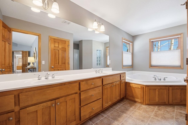 1496 Pinetree Trl, Eagan, MN 55122 - bathroom featuring double vanity, a bath, and tile patterned floors