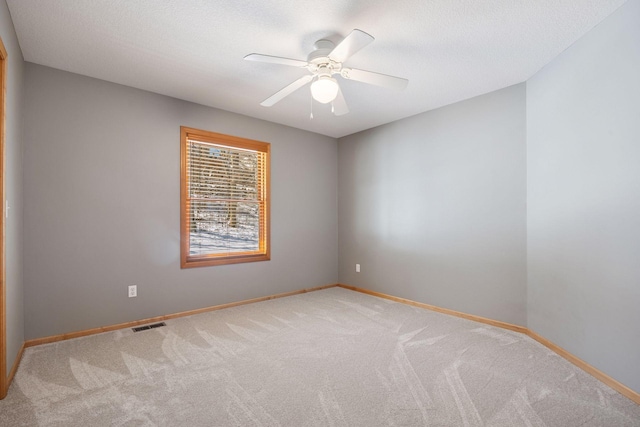 1496 Pinetree Trl, Eagan, MN 55122 - empty room featuring carpet flooring, a ceiling fan, baseboards, and a textured ceiling