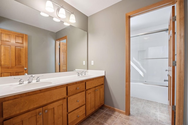 1496 Pinetree Trl, Eagan, MN 55122 - full bath featuring double vanity, combined bath / shower with glass door, tile patterned flooring, and baseboards