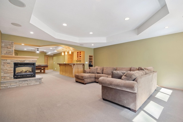 1496 Pinetree Trl, Eagan, MN 55122 - living area with light carpet, arched walkways, recessed lighting, a tray ceiling, and ceiling fan