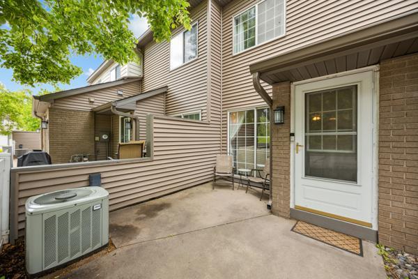 9955 Russell Ave N Unit 10, Brooklyn Park, MN 55444 - view of patio featuring central air condition unit