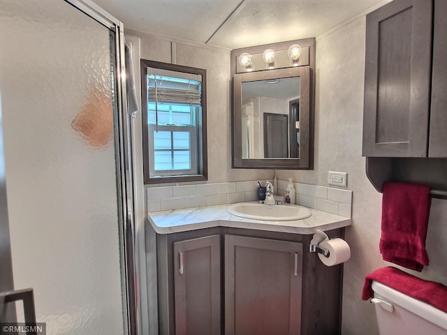 10255 Nevens Ave NW Unit 50, South Haven, MN 55382 - full bath featuring toilet, vanity, a stall shower, and tasteful backsplash
