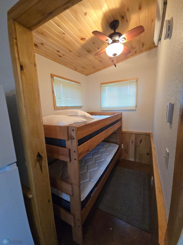 14768 Tradewinds Rd, Lake Eunice Twp, MN 56511 - bedroom featuring wood ceiling, freestanding refrigerator, and a wainscoted wall