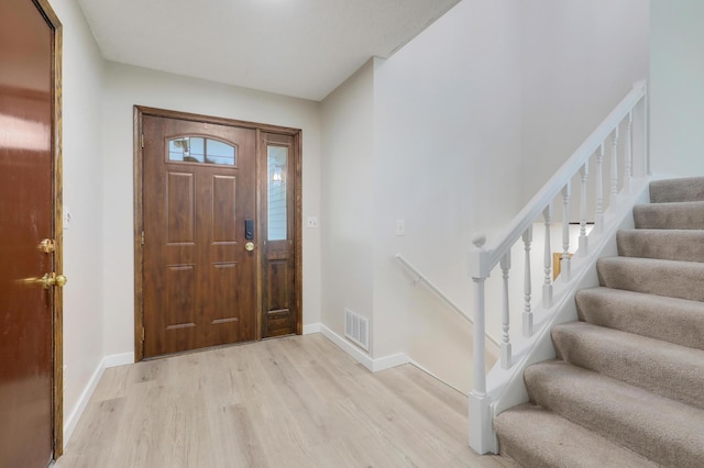 16503 Franklin Trl SE, Prior Lake, MN 55372 - entryway with light wood-style floors, stairway, and baseboards